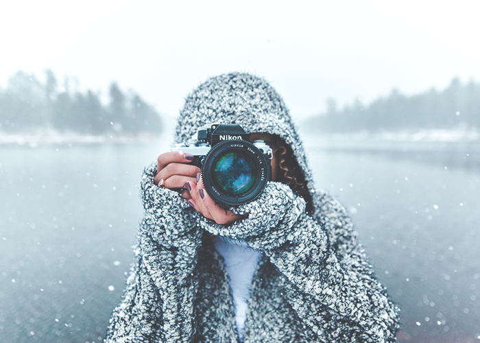 tfd_woman-taking-photo-covered-in-snow